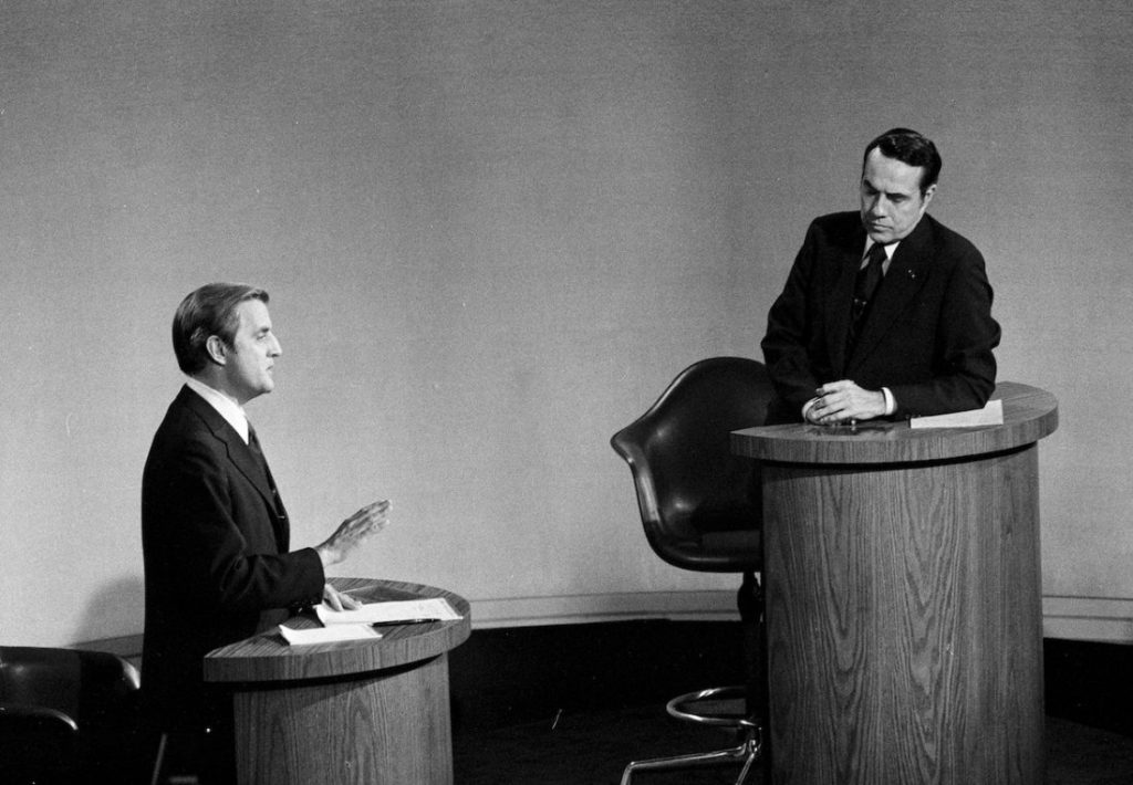 Senator Walter Mondale, D-Minn., left, speaks as Senator Robert Dole, R-Kan., listens during the Vice Presidential debate in Houston, Texas, Oct. 15, 1976. The debate was televised. (AP Photo)